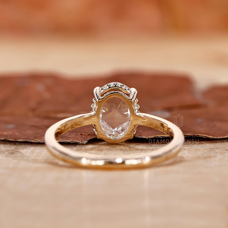 Yellow Gold Engagement Ring with an exquisite oval diamond.