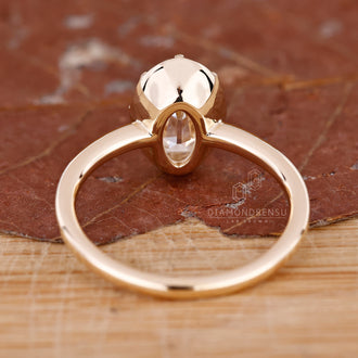 Lab-grown diamond ring with oval old European cut in claw prong setting.