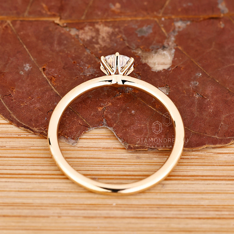 Classic round diamond solitaire ring crafted in yellow gold handmade style.