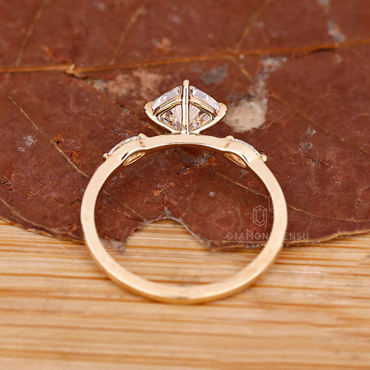 Custom engagement ring featuring marquise accents.