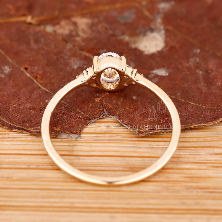 Buy engagement ring with oval diamond and seven stone arrangement.