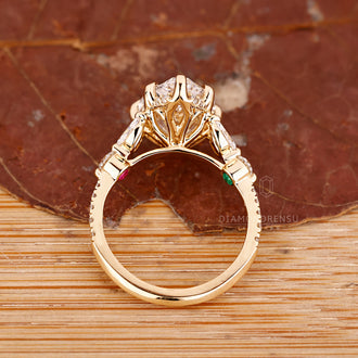 Tulip setting ring with pear cut diamond and six claw prong.