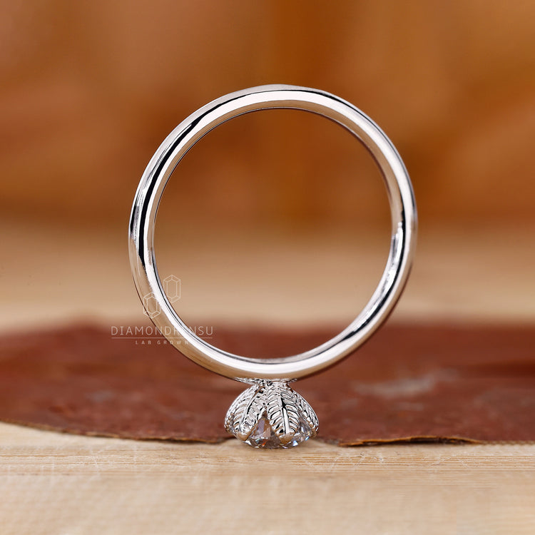 Handmade Ring featuring a round diamond in a solitaire setting.
