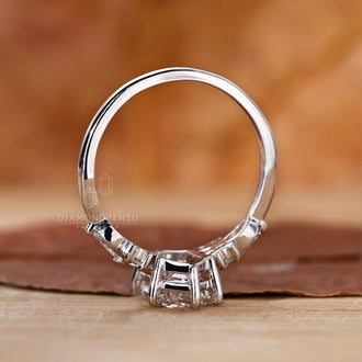 Hexagon cut diamond engagement ring with side stones.