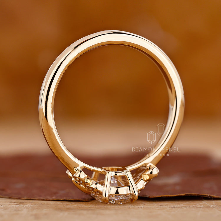 Gold butterfly ring with oval diamond accents for a stunning look.