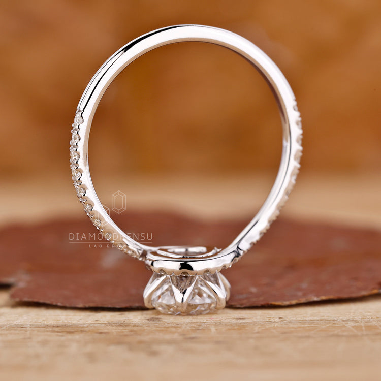 White gold jewellery ring with a sophisticated Portuguese cut diamond setting.