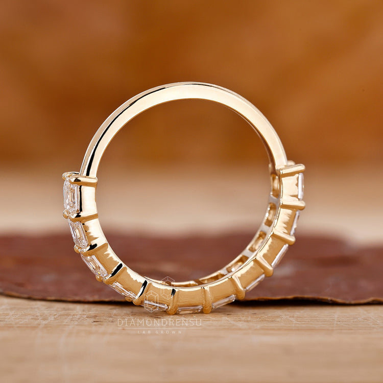 Handmade yellow gold Asscher cut band.