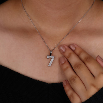 Round diamond pendant in hip hop style with prong setting.