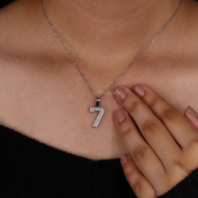 Round diamond pendant in hip hop style with prong setting.