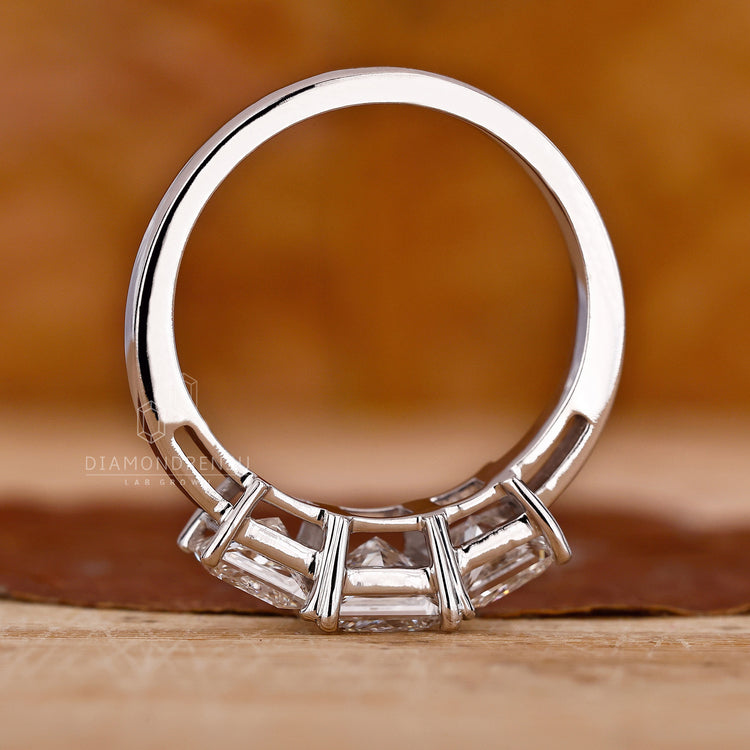 Diamondrensu ring featuring a princess cut diamond.