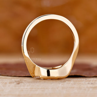 Yellow gold half bezel ring with an IGI certified marquise cut diamond