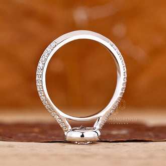 Custom diamond ring with round cut diamond and pave band style.