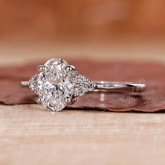 Oval Ring with Round Side Stones for added brilliance.