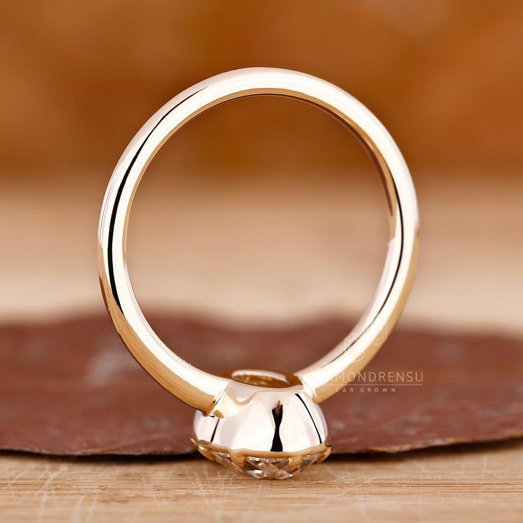 Handmade oval old European cut solitaire ring with custom design.