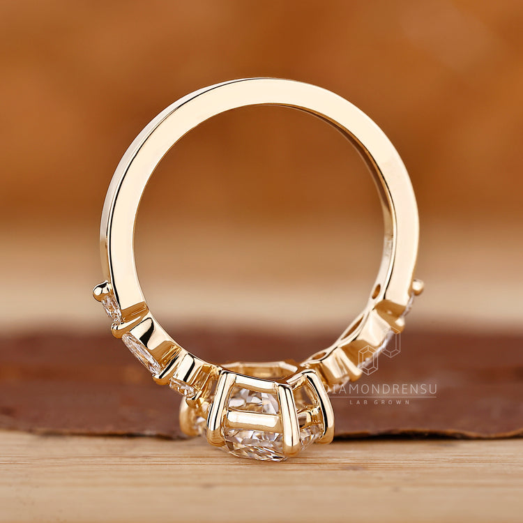 Yellow gold engagement ring with lab grown diamond center.
