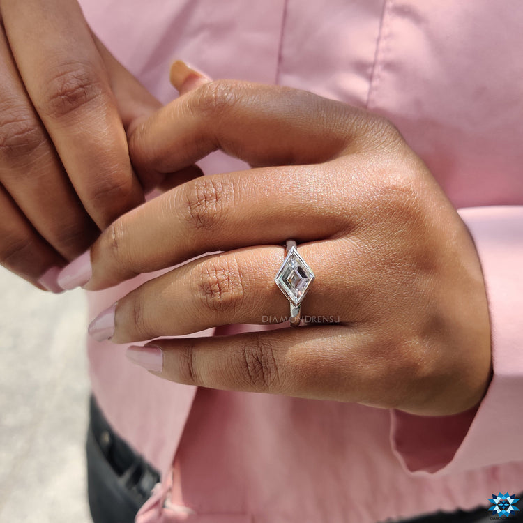 Lozenge cut moissanite ring crafted in white gold.