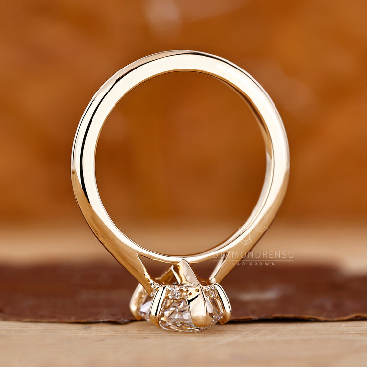 V prong setting with solitaire engagement ring.
