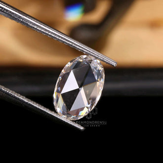 Loose diamond in oval cut shape is lab grown and certified.