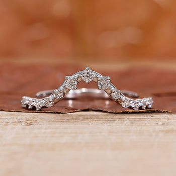 Curved White Gold Wedding Band with elegant diamond accents.