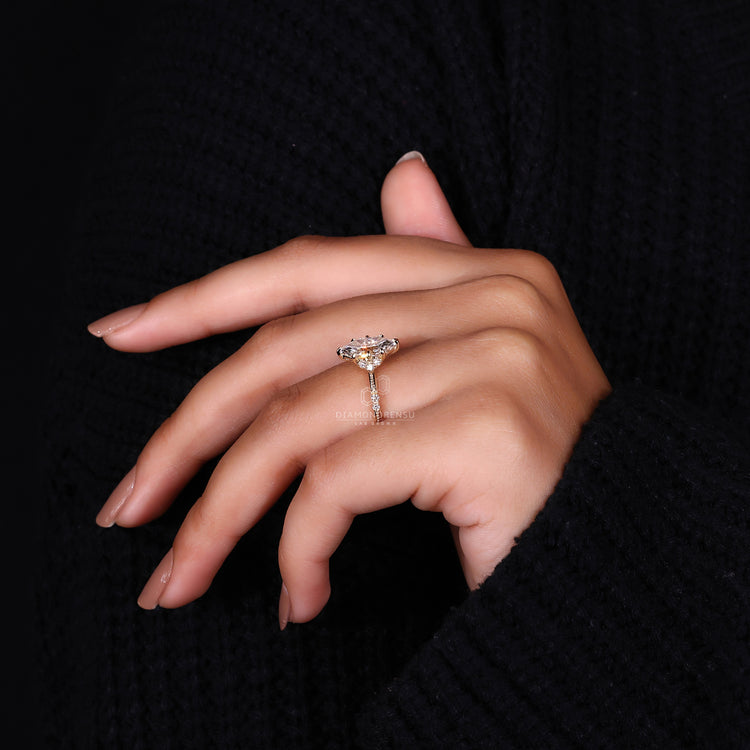 Milgrain setting ring with marquise center and round side diamonds.