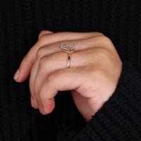 Yellow gold engagement ring with a pear-shaped diamond for a traditional look.