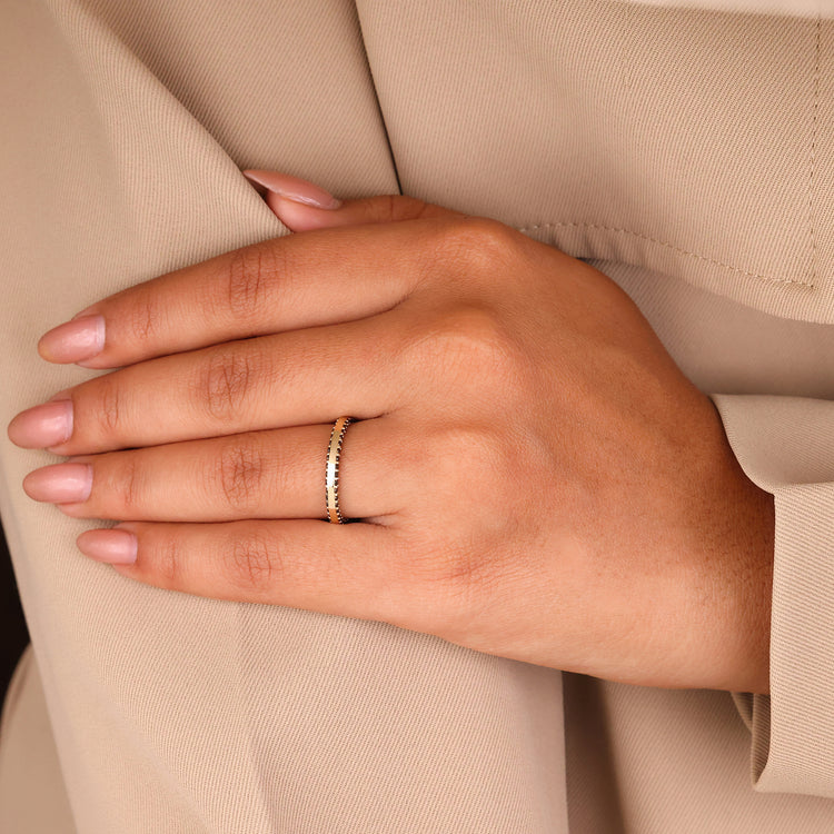 A stylish wedding band stack featuring eternity rings.