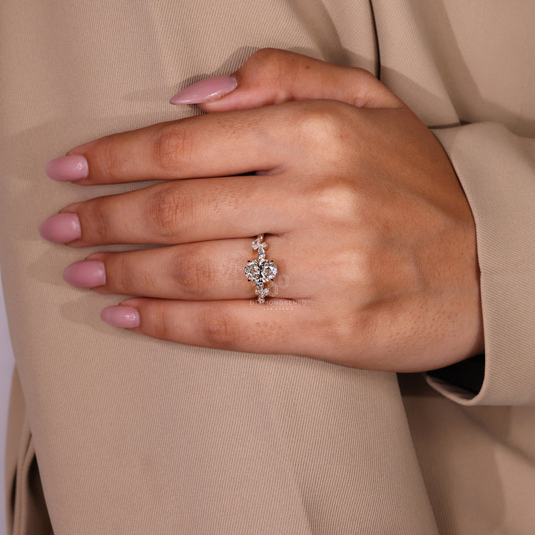 Oval ring with side stones, perfect for a unique engagement ring.