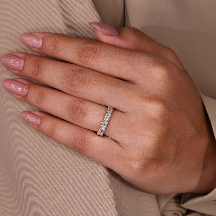 Yellow gold diamond wedding band with princess and baguette cuts.