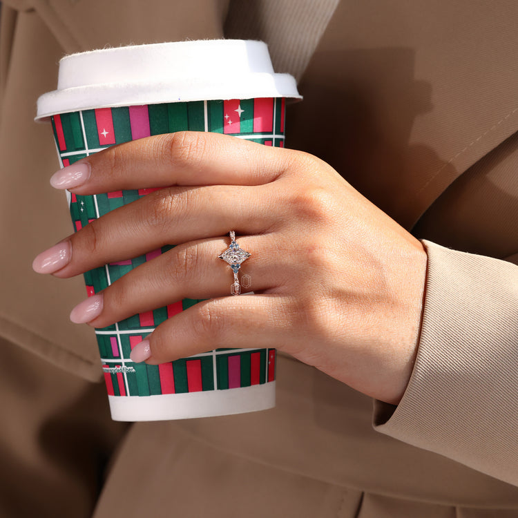 Rose gold engagement ring with a mesmerizing marquise diamond and delicate milgrain setting.