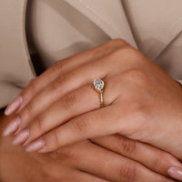 Unique east west engagement ring in yellow gold for a modern look