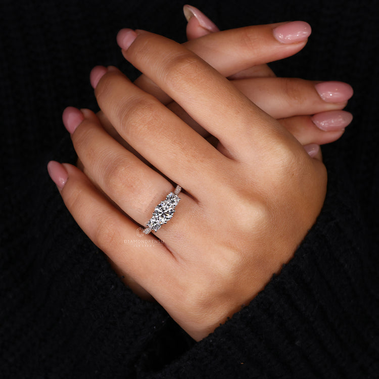 Round Diamond Engagement Ring with a tapered pave setting.