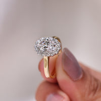 Round diamond ring in a classic solitaire style with a 4 claw prong