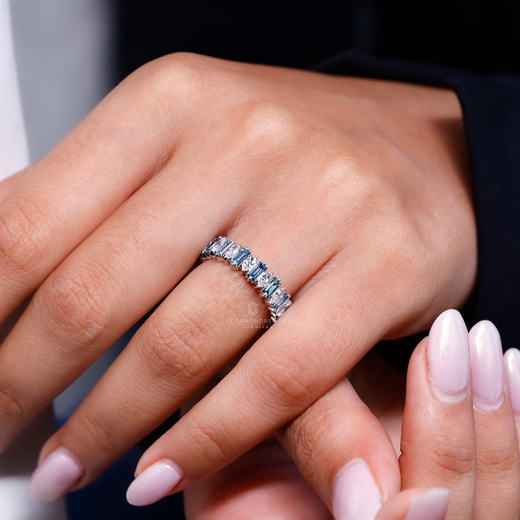 Blue Baguette Cut Diamond featured in a half eternity wedding band.