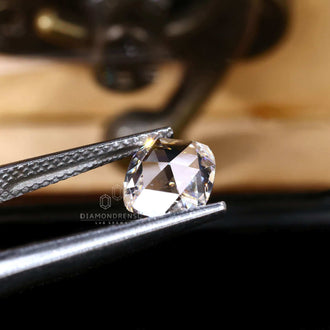 This diamond is a lab grown loose stone with an antique cushion rose cut.