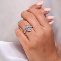 Cathedral setting ring with white gold engagement ring.