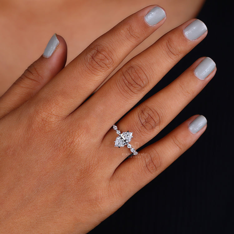 Marquise Side Stone Engagement Ring featuring IGI certified diamonds.