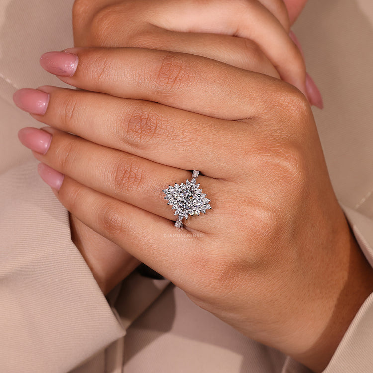 Halo diamond ring with marquise cut diamond for added elegance.