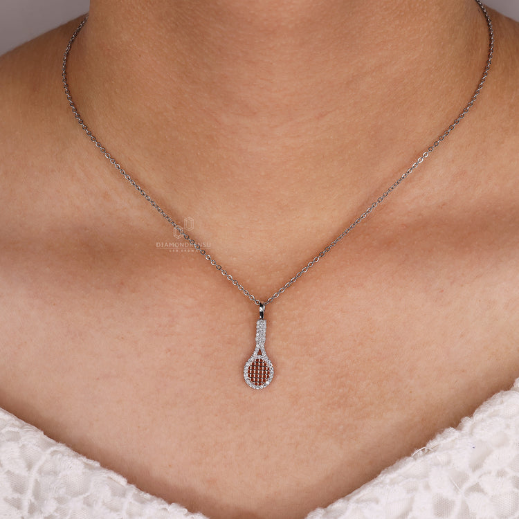 Men's racket charm pendant in white gold with diamond accents.