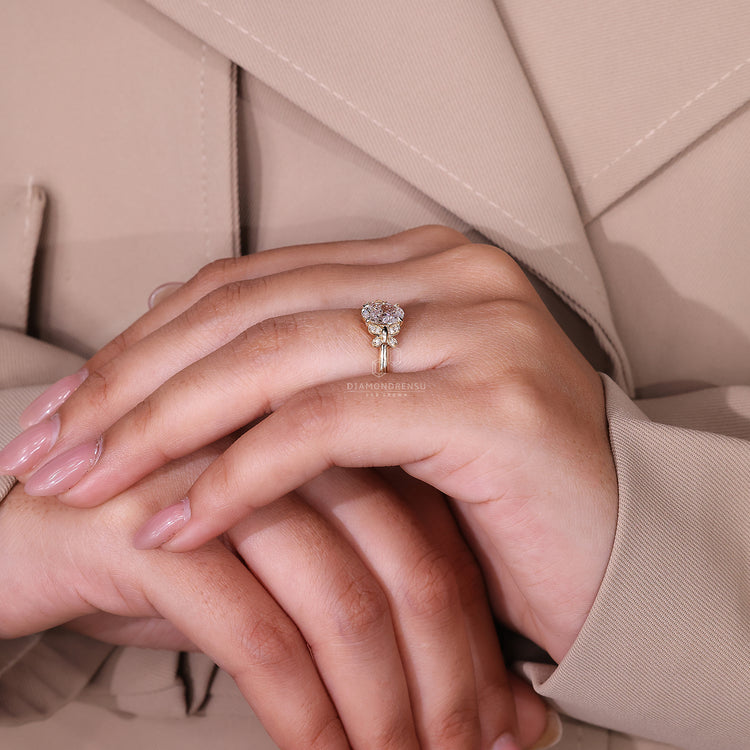 Butterfly engagement ring with an oval diamond for a unique and romantic touch.