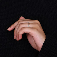 Round-cut diamond chevron band with a timeless appeal.