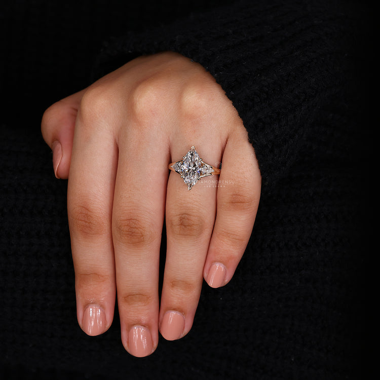 Three Stone Marquise Diamond Ring with Pear Side Diamonds.