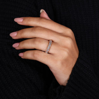 Elegant eternity band in rose gold, perfect for a wedding or anniversary.