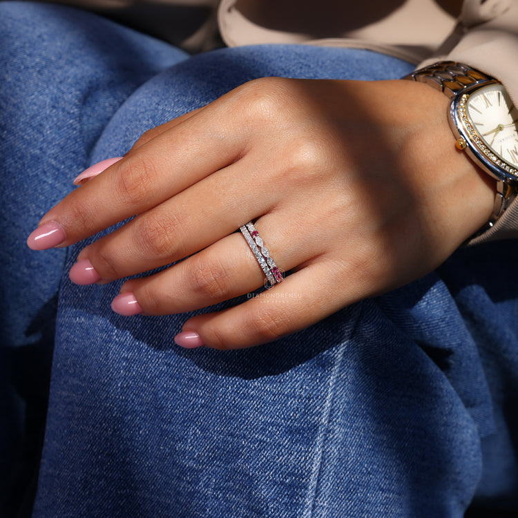 Diamondrensu wedding band featuring round diamonds and a white gold setting.