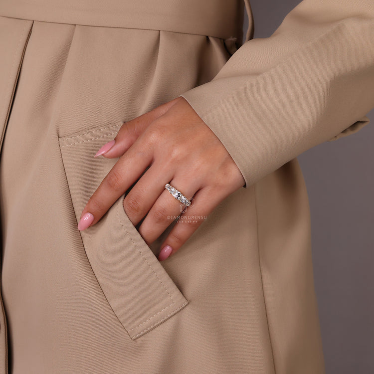 Custom wedding band featuring 7 stone diamonds and yellow gold.