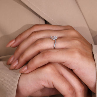 Solitaire Ring with a captivating pear-shaped diamond centerpiece.