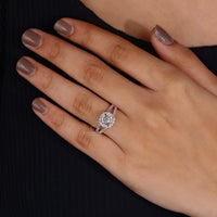 Woman's hand gracefully showcasing the vintage rose gold engagement ring