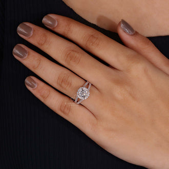 Woman's hand gracefully showcasing the vintage rose gold engagement ring