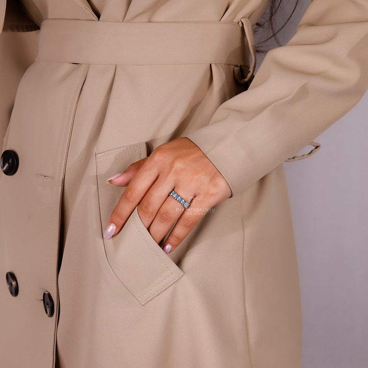 Handmade Jewelry band featuring blue baguette cut diamonds.