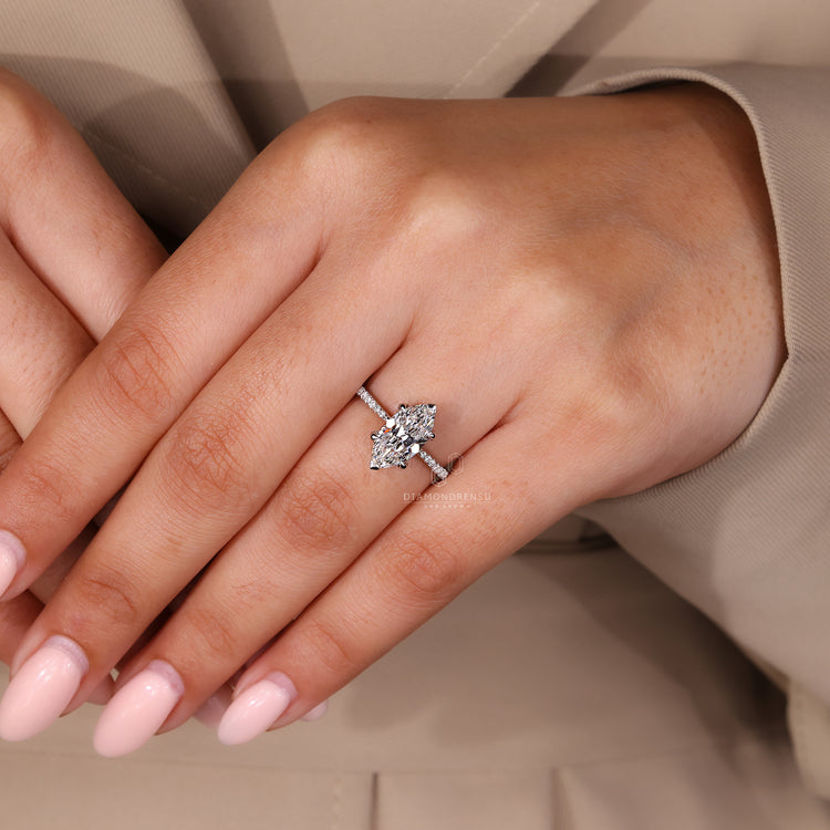 Classic marquise diamond ring with pave setting.