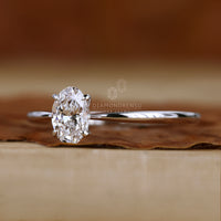 Tapered ring shank enhancing the diamond's brilliance.